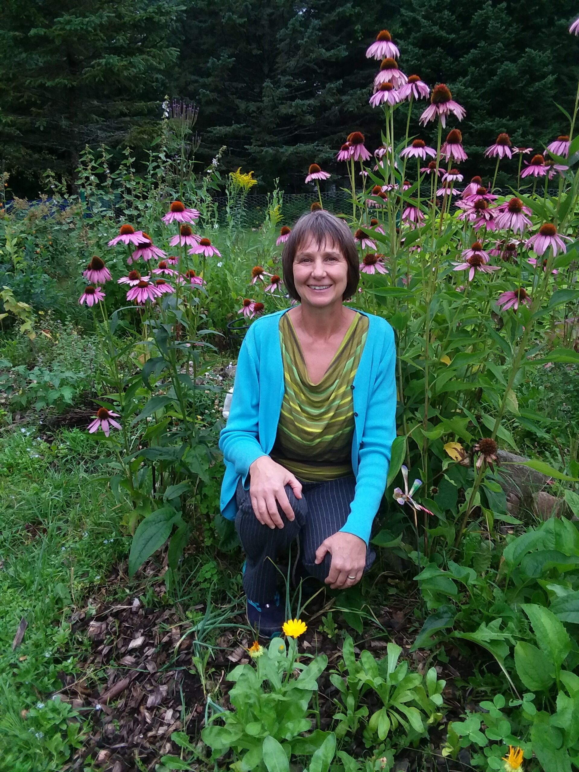 A woman sitting in a flower field