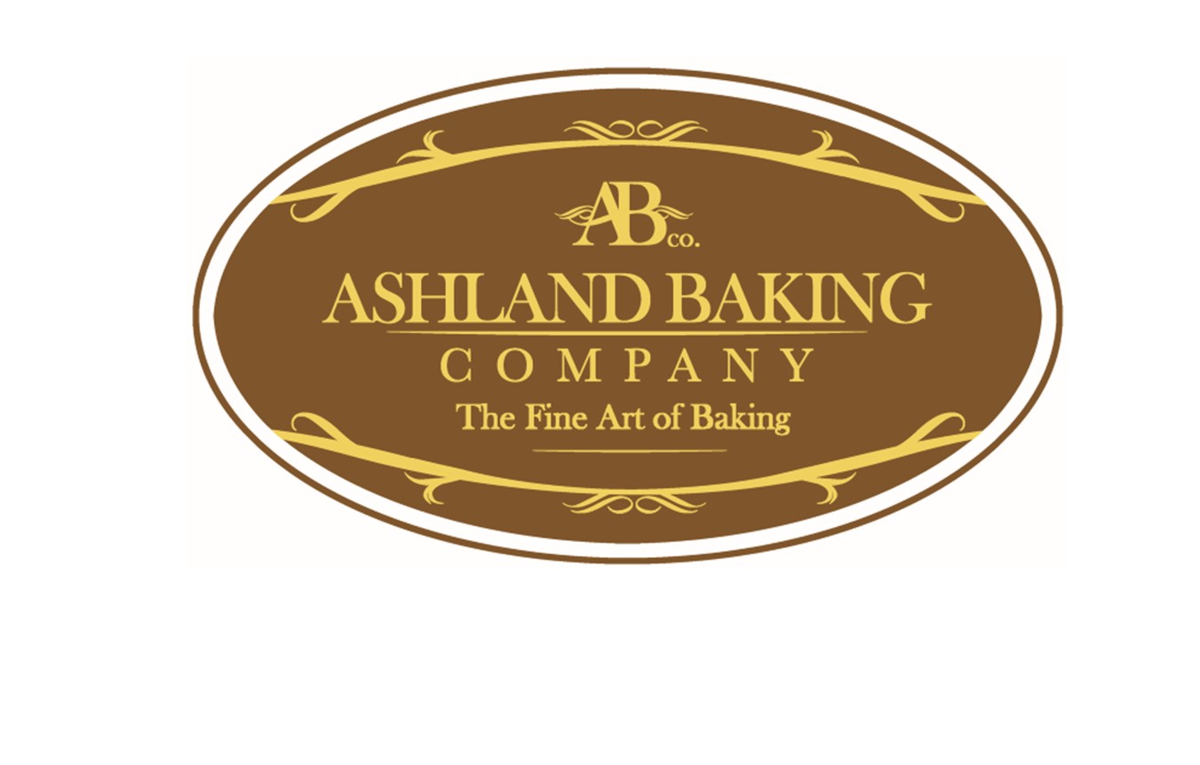 A logo featuring an oval-shaped emblem with a brown background and gold trim. At the top, "AB co." is written in gold, followed by "Ashland Baking Company." Below that, the slogan "The Fine Art of Baking" is displayed prominently. Perfect for your next stop for coffee in Duluth.