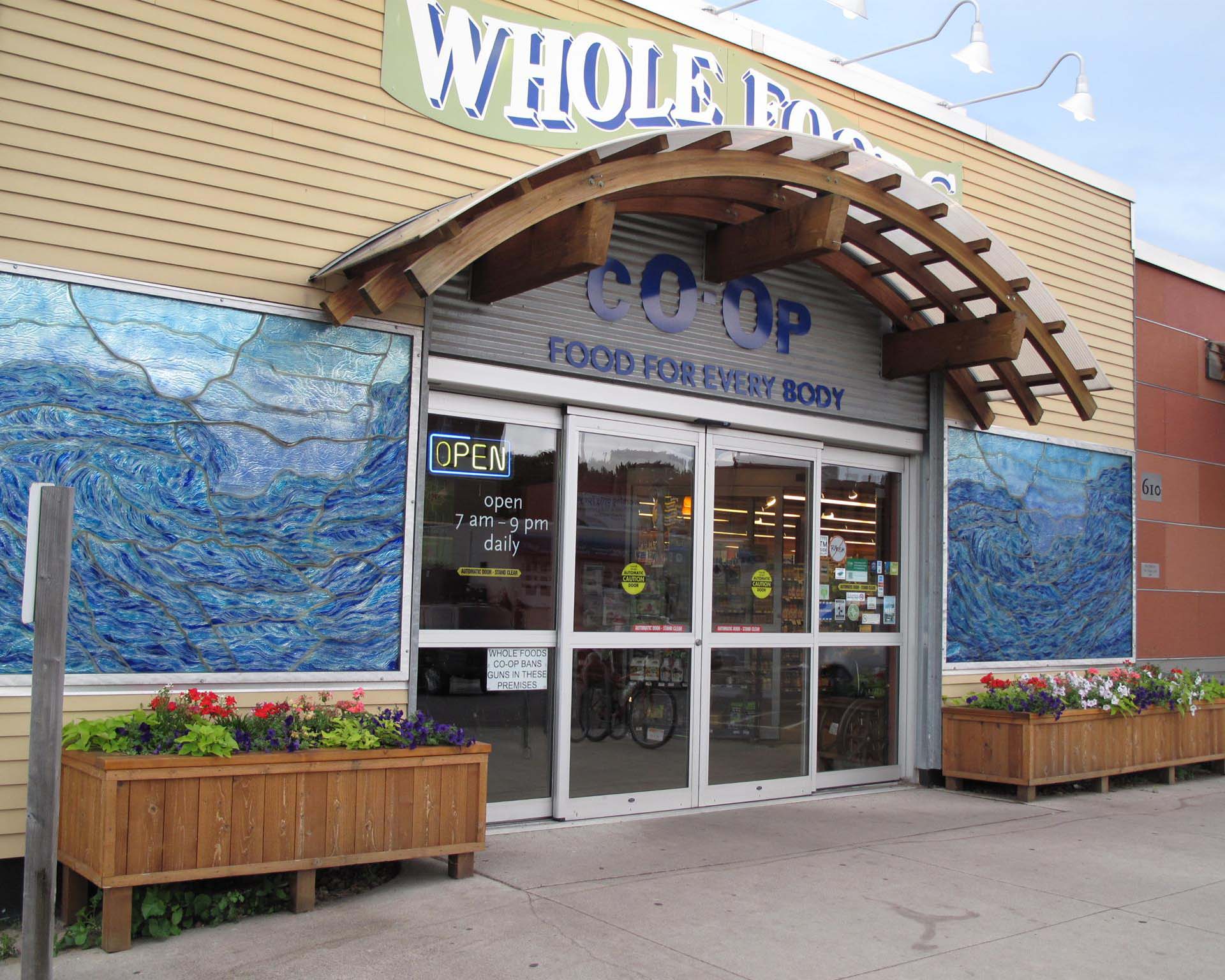 A storefront of the grocery cooperative, Whole Foods Coop Duluth MN, with the sign 