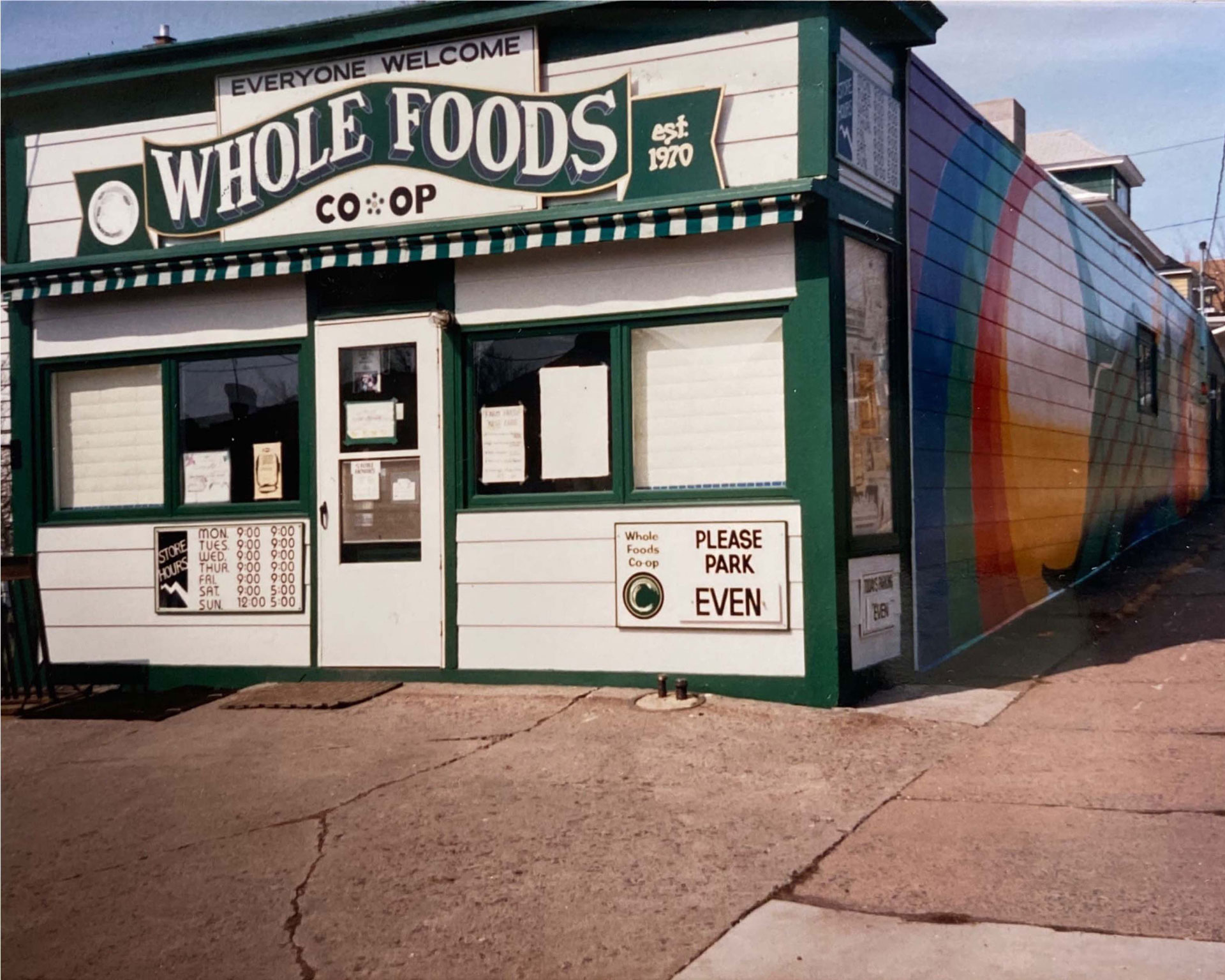 This image shows the exterior of a small grocery store called 