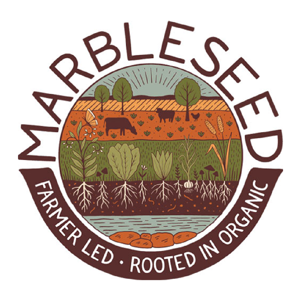 Logo for MarbleSeed with an illustration of crops and animals above soil containing plant roots and water. Text reads "MARBLESEED" at the top and "FARMER LED · ROOTED IN ORGANIC" at the bottom.