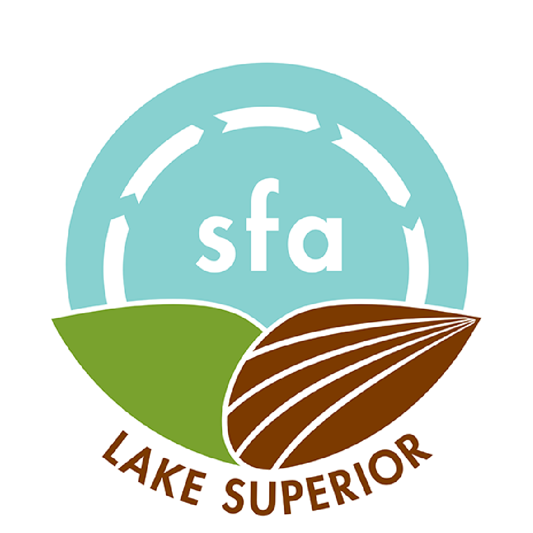 Logo of Lake Superior Sustainable Farming Association (SFA). The design includes a light blue circle with white arrows, "sfa" in the center, and green and brown fields overlapping at the bottom with "Lake Superior" written below the fields.