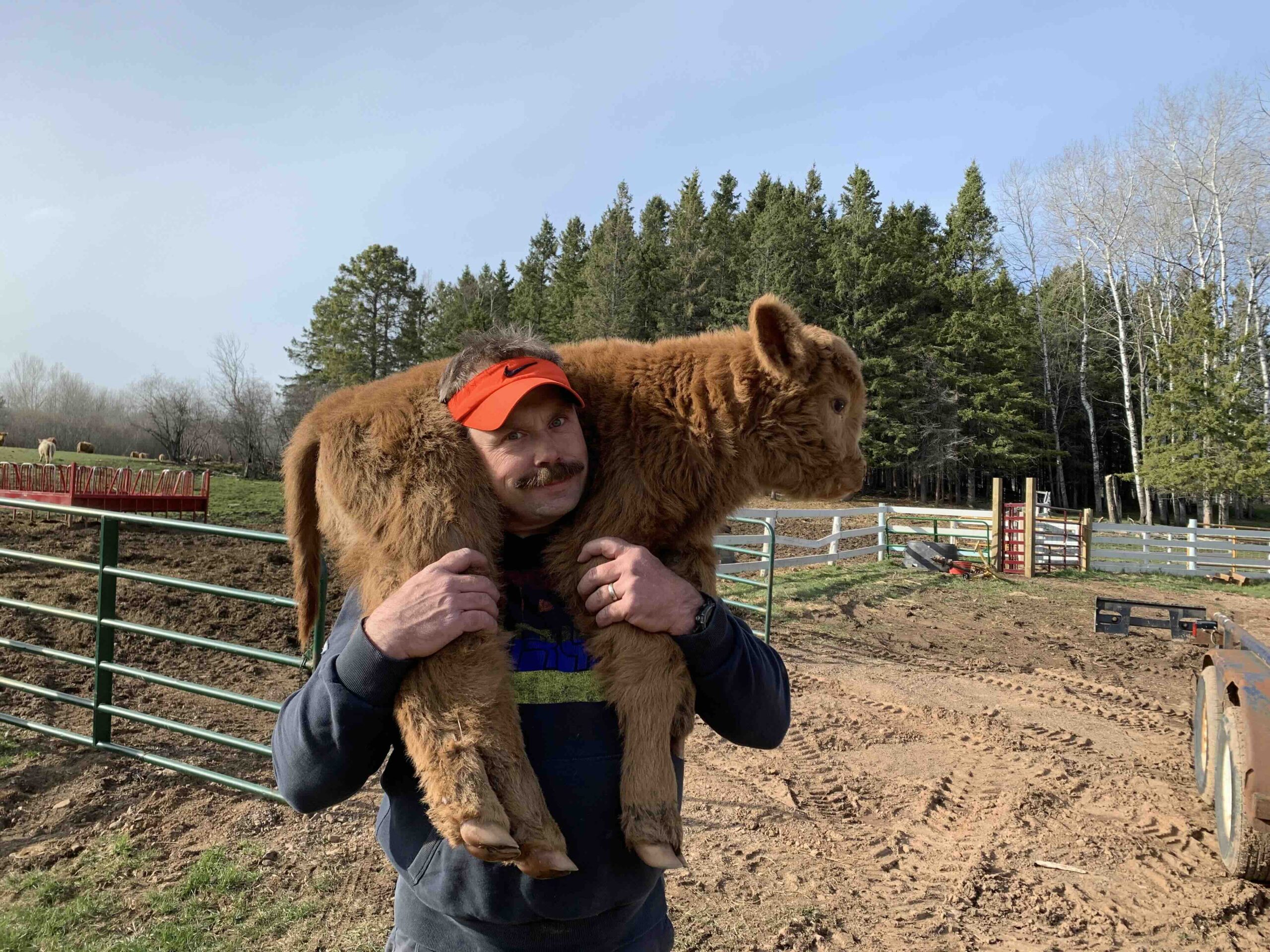 Jason Paulson holding calf over his shoulders