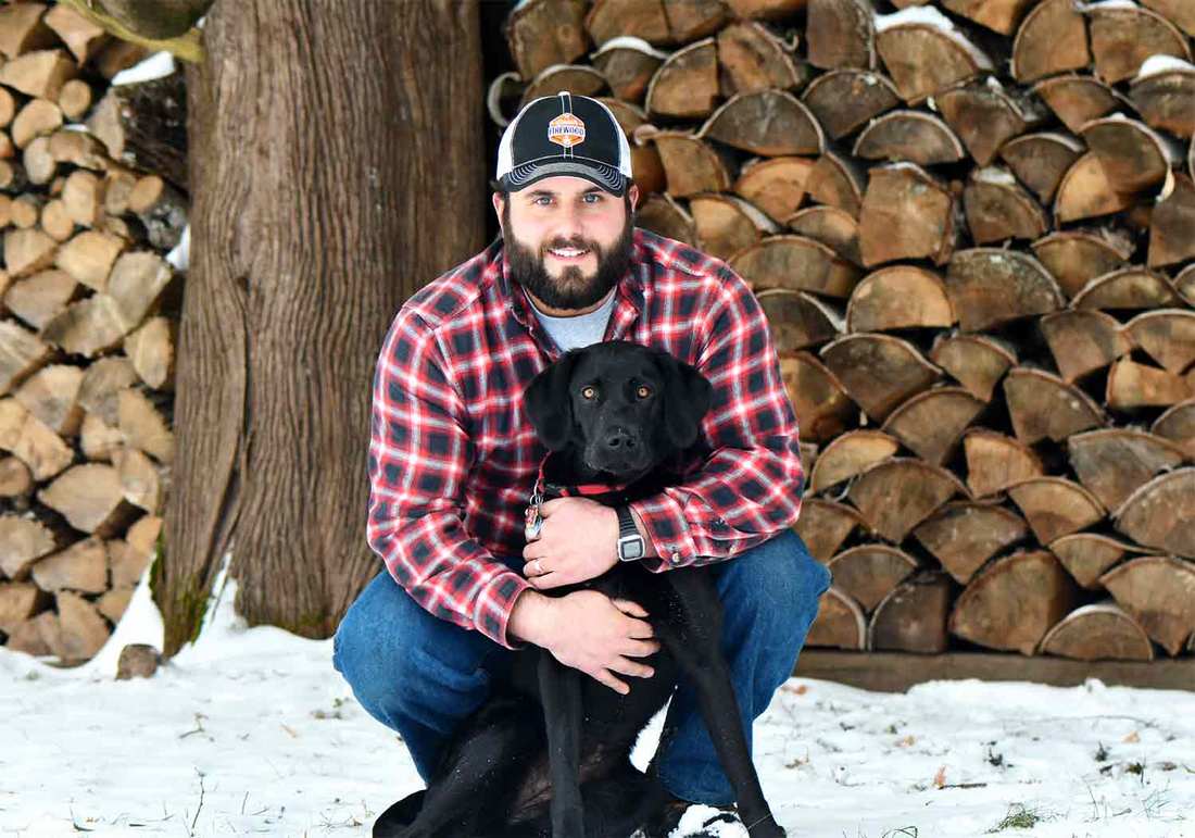 Duluth Firewood owner, Wade Haworth and his dog.