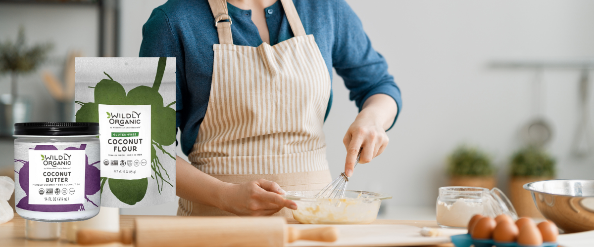 Person wearing apron mixing ingredients for baking