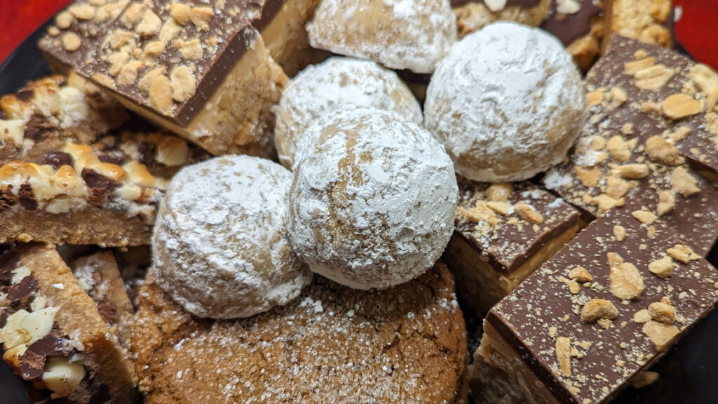 Holiday Sweets Tray with Ginger Cookies, Mexican Wedding Cookies, Vegan Macaroon Cookies, 7 Layer Bars, and Crunchy Peanut Butter Bars