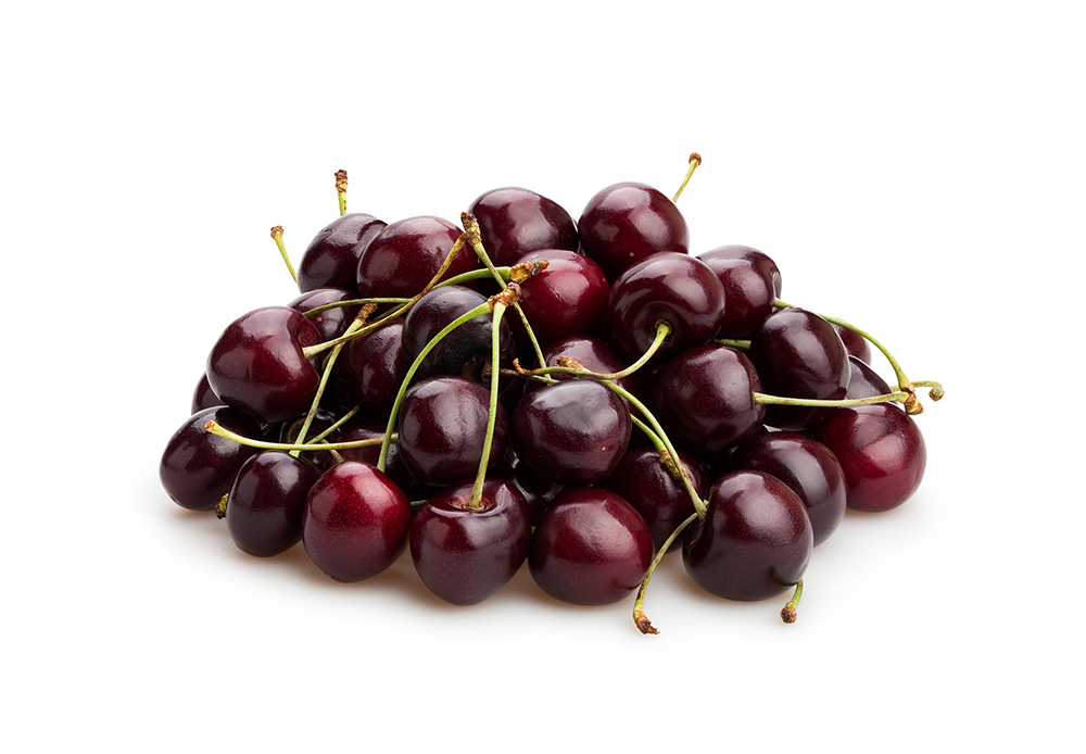 A pile of dark red cherries