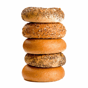 A stack of assorted bagels on a white background.