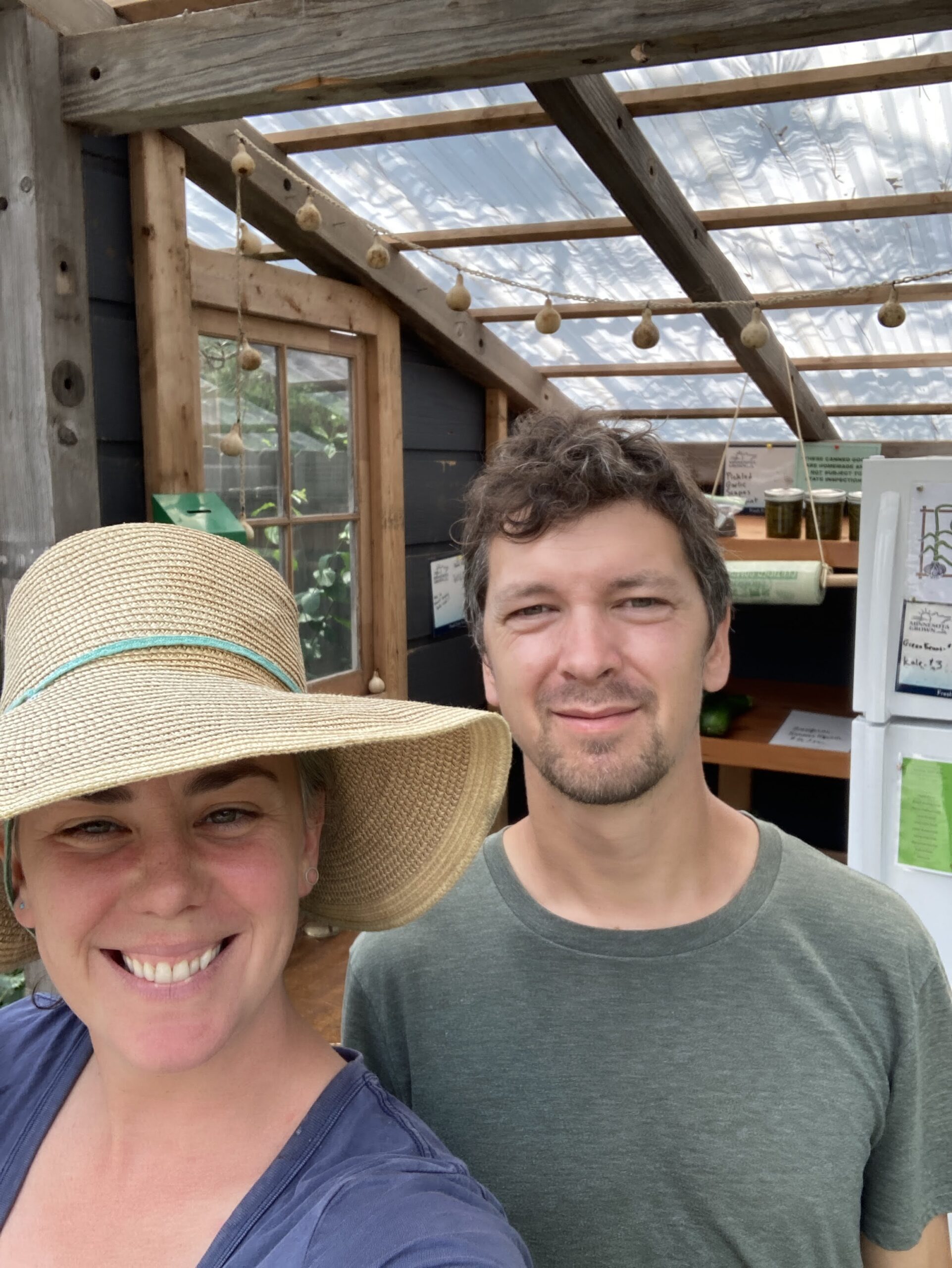 Sörestad Farm owners in front of their farm stand.