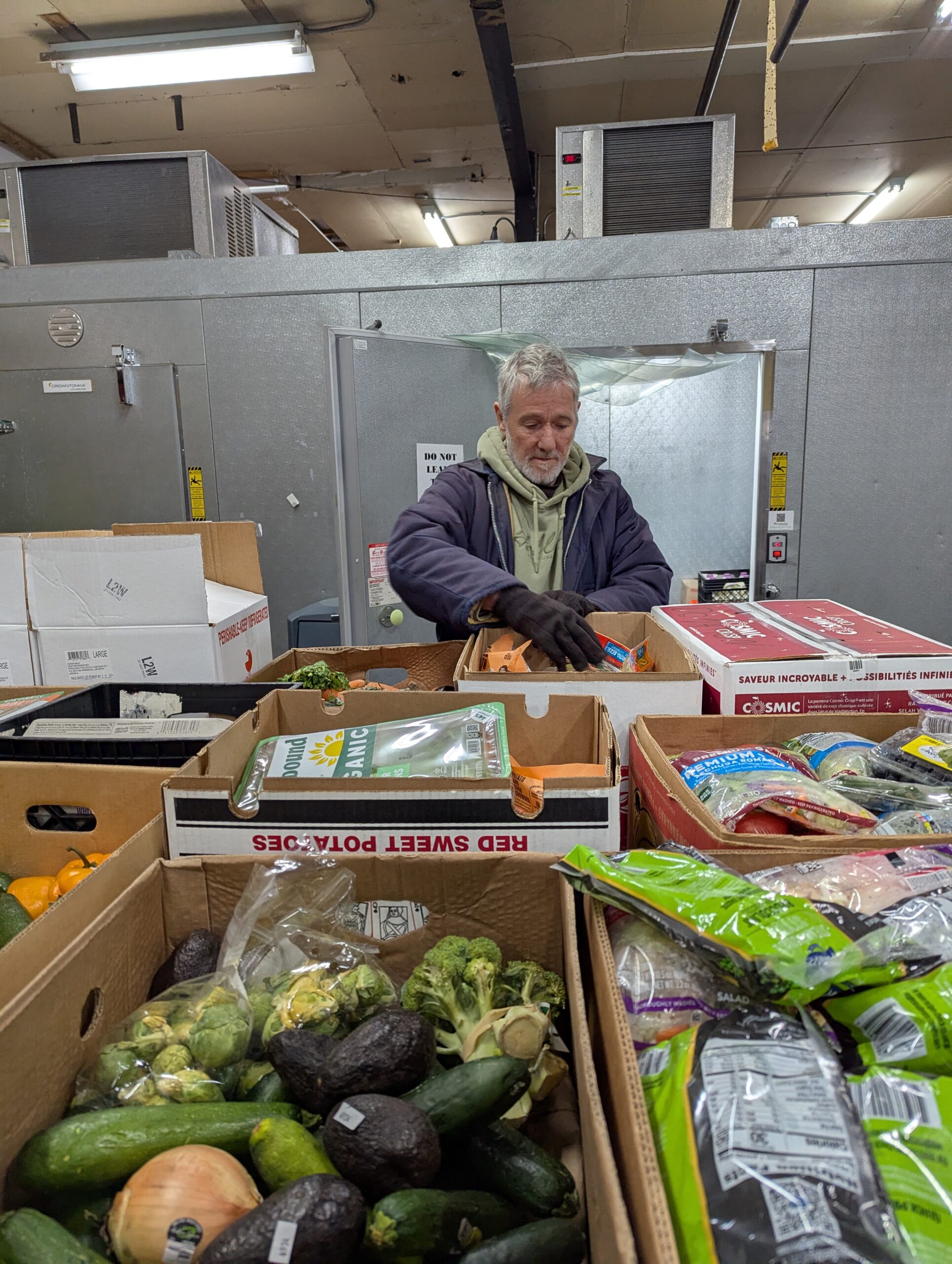 Food donated by Whole Foods Co-op is sorted at Second Harvest Northland.